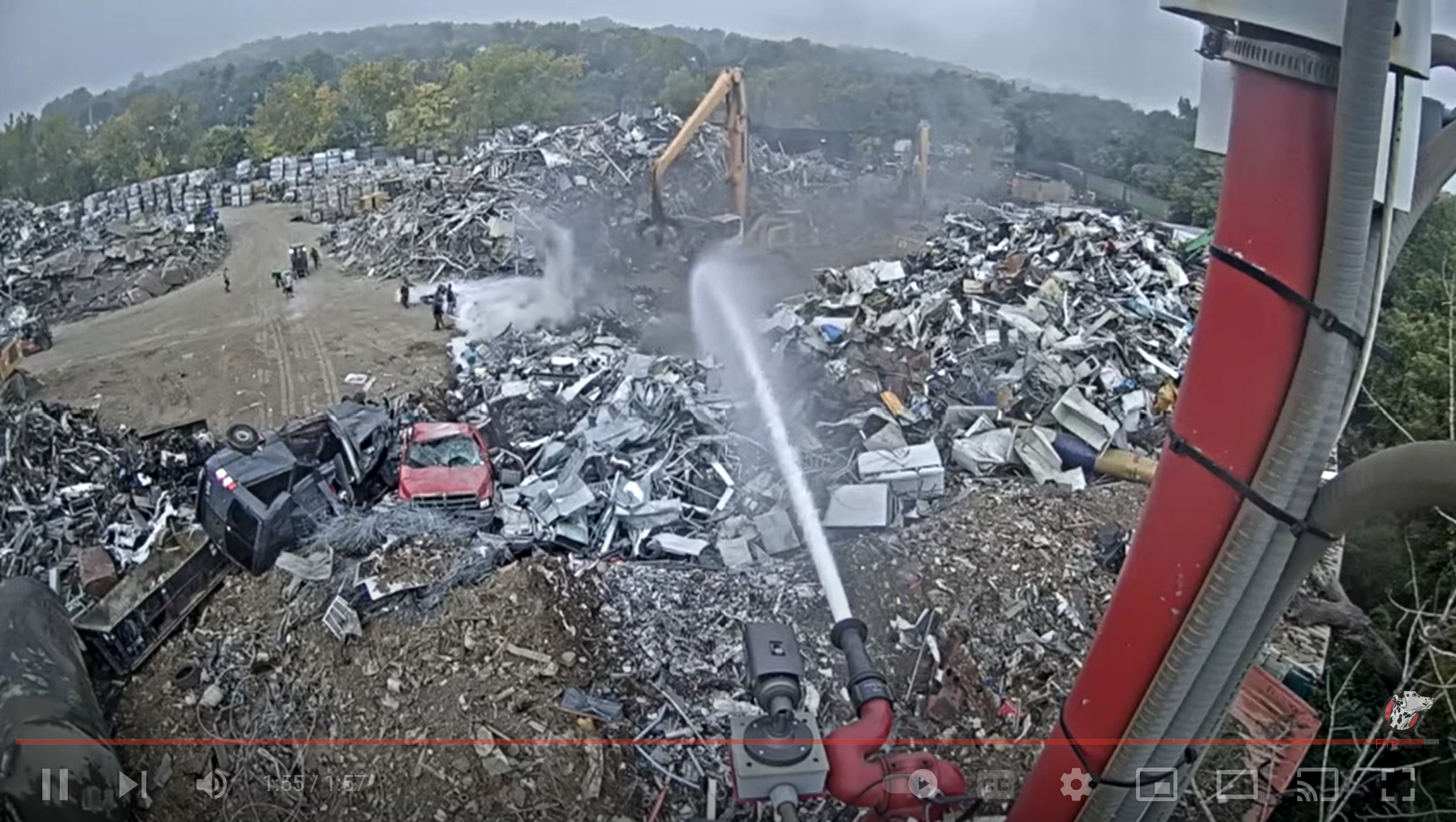 video of FR spraying outdoor scrap yard fire