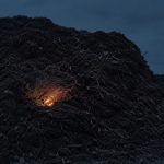Biomass pile after dark, unmonitored subsurface hotspot becoming larger.