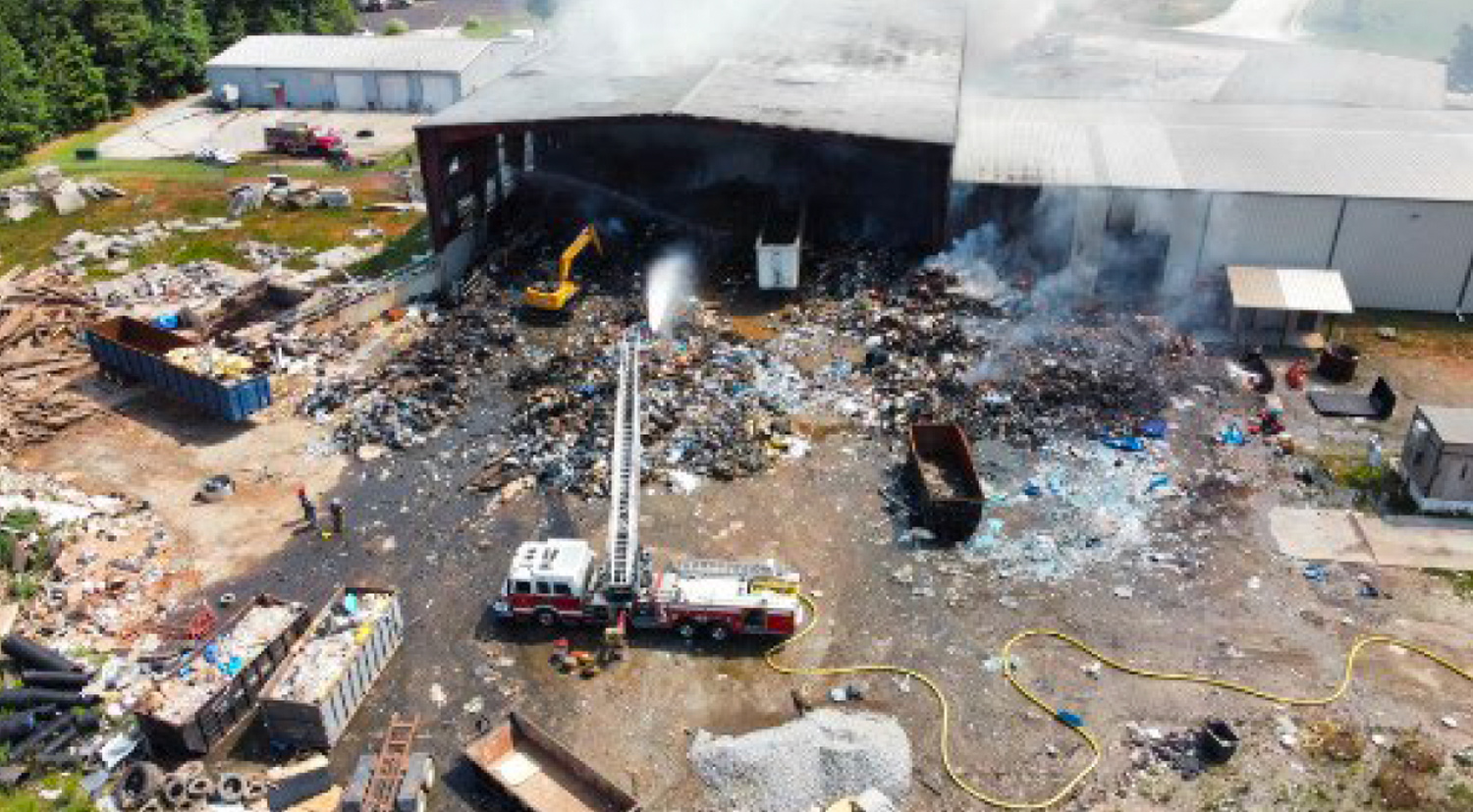 Fire truck responding to a fire at a waste and recycling facility.
