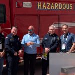 Ryan Fogelman and others posing in front of a fire truck at ReMA Safety Plaza San Diego May 2025